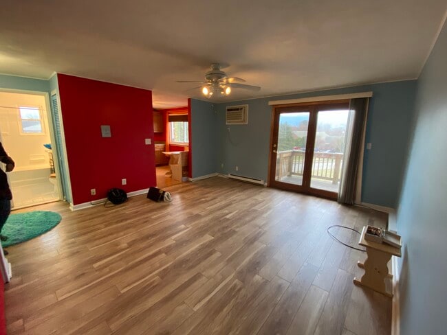 Living space with open balcony view - 9 Mayberry Dr