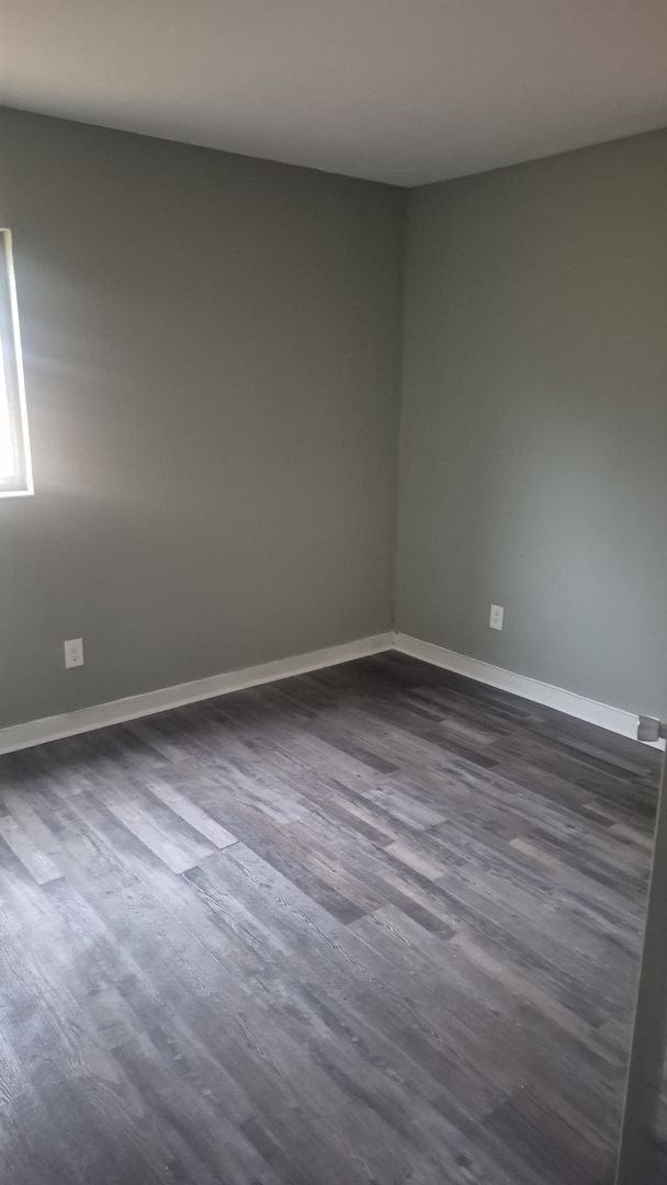 Building Photo - Cozy Home with Updated Flooring and Bright Rooms