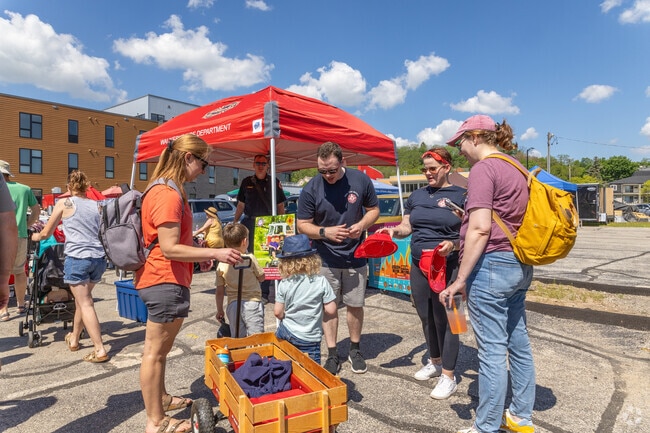 Waukesha firefighters hand out prizes to the kids at the Waukesha Farmers Market.