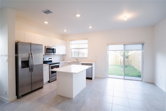 Photo - 12133 Northwest 23rd Court Apt #12133, Miami, FL 33167 - 3 BR 3 BA townhouse