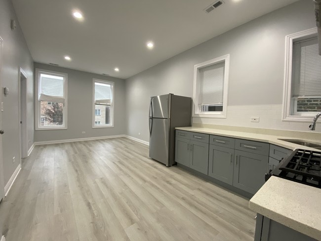 Open Kitchen with brand new appliances - 2932 S Normal Ave