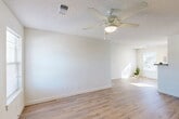 Located at 600 E Little York Rd in Houston, TX, this single-story home offers four bedrooms, two bathrooms, and a well-organized layout designed for comfortable everyday living. The open-concept living, dining, and kitchen area serves as the heart of the home, featuring light wood-look hard surface flooring, neutral white walls, and ceiling fans with integrated lighting. Natural light streams in through multiple windows, creating a bright and airy atmosphere throughout.

The kitchen is equipped with warm wood cabinetry, a double-basin stainless steel sink, laminate countertops, and black appliances, including a refrigerator and range. A window above the sink brings in additional natural light. The layout connects seamlessly to the dining and living areas, making it ideal for everyday use and entertaining.

Each of the four bedrooms is carpeted and features a ceiling fan, a closet, and windows with blinds that allow for natural light and privacy. The primary bedroom offers a generous footprint with its own closet access. The two bathrooms are clean and functional, each featuring a tub-shower combination. Additional highlights include a dedicated laundry area, a patio for outdoor enjoyment, and ample closet storage spread throughout the home.