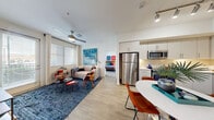 Located at 1545 Wigwam Parkway in Henderson, NV, this thoughtfully designed 2-bedroom, 2-bathroom residence offers a clean, modern aesthetic throughout. Light wood-style flooring flows through the main living areas, connecting the open-concept living room, dining area, and kitchen into one cohesive, well-lit space. The kitchen is equipped with stainless steel appliances — including a refrigerator, microwave, and dishwasher — complemented by white cabinetry, a subway tile backsplash, and under-cabinet lighting. Track lighting above adds a contemporary touch. The living room features a ceiling fan and large windows that invite natural light, creating a bright and airy atmosphere. Both bedrooms are well-proportioned, with the primary bedroom offering a comfortable, restful retreat. The two bathrooms are finished in a clean, minimal style, one featuring a full soaking tub. A dedicated laundry area, multiple closets providing ample storage, and a private patio round out the interior features. The attached garage is a standout practical amenity, offering secure parking and additional storage space. The overall ambiance is modern and welcoming, ideal for comfortable everyday living in the heart of Henderson.