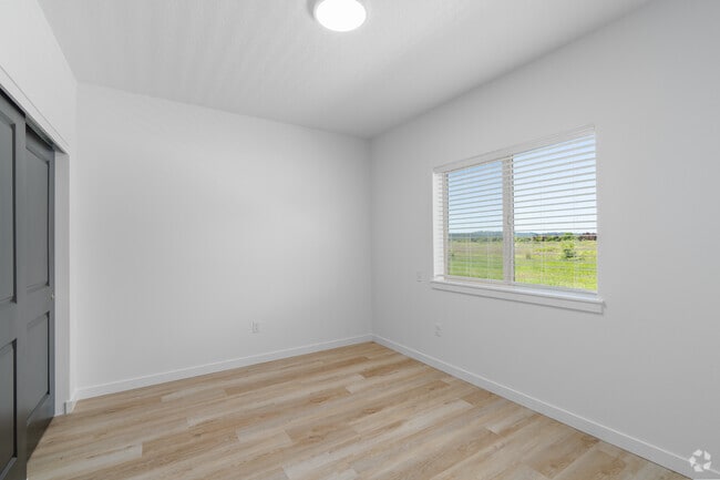 3BR, 2BA - 1,149SF - Primary Bedroom - Riddell Apartments