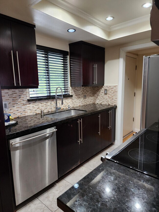 Kitchen looking towards front door and entry - 1517 E Garfield Ave