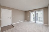 Located at 1767 Oro Vista Road in San Diego, CA, this single-story, 3-bedroom, 3-bathroom home offers a practical and well-organized layout. The interior features warm neutral tones, textured ceilings, and clean white baseboards throughout, creating a cohesive and inviting atmosphere.

The kitchen stands out with crisp white shaker cabinetry, marble-style countertops, stainless steel appliances including a refrigerator and dishwasher, and light wood-look flooring — a bright, functional space designed for everyday use. It connects seamlessly to the dining area via a pass-through opening, which overlooks a combined living and dining space with a ceiling fan, warm carpeting, and hardwood-style flooring in the dining area.

The primary bedroom is generously proportioned, bathed in natural light, and features carpeted floors along with direct access to a private en-suite bathroom with a vanity and mirror. A dedicated closet provides convenient storage. The two additional bedrooms also feature soft carpet, natural light from vertical-blind-covered windows, and access to their own closets.

The three bathrooms are clean and functional, each featuring a tub-shower combination with chrome fixtures and wood-look flooring. A private patio with a railing offers outdoor access, rounding out this well-appointed San Diego home.