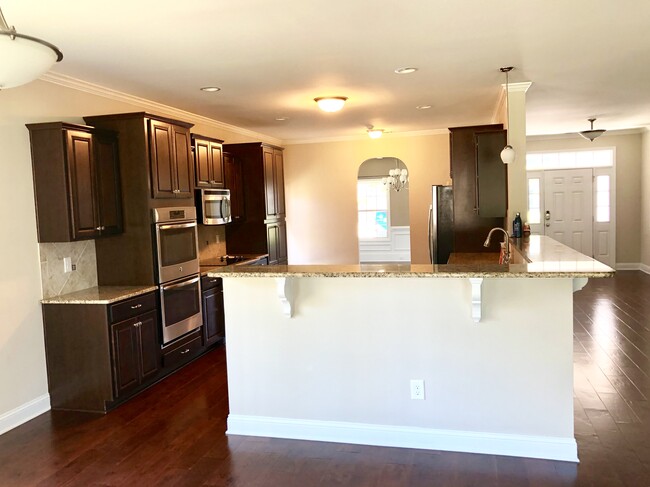 Kitchen from breakfast nook/back door. - 3340 Amour Dr.