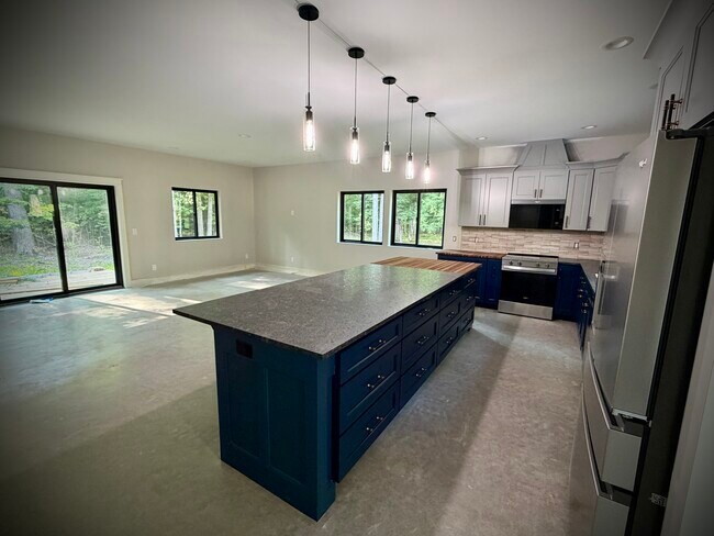 Ample cupboard space. Open concept floorplan. - 10671 US 31