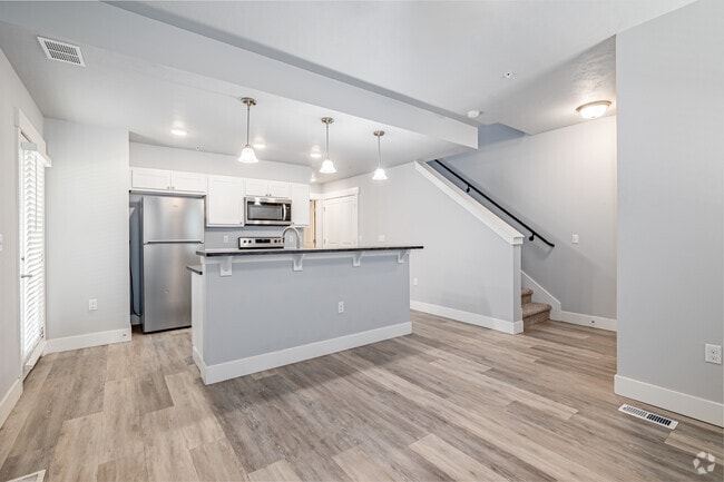 2BR, 2BA - 996SF - Kitchen / Living Room - The Village Apartments and Townhomes
