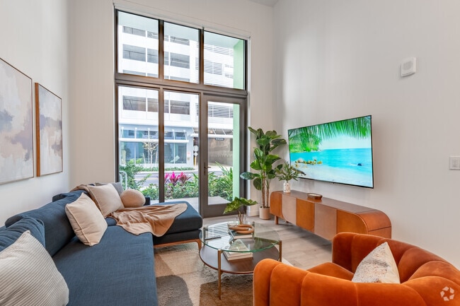 1BR, 1BA - 649SF - Living Room - The Tropic Apartments