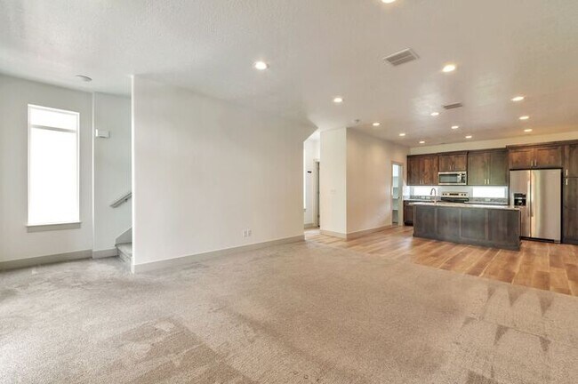 Building Photo - Modern End Unit townhouse w attached 2 car...