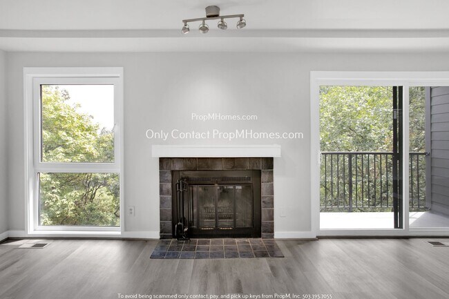 Building Photo - Charming Condo with Covered Parking and Tr...