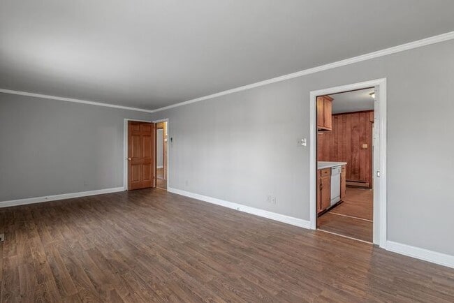 Building Photo - Large Brick Ranch, New Wood Like Flooring Throughout, Just Painted, LR, Den, Sun Room, Carport!