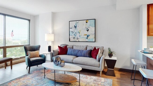 Light-filled living areas create a bright and welcoming atmosphere. - Midtown Crossing Apartments