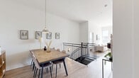Located at 9675 Avenue Papineau in Montréal, this contemporary 2-bedroom, 1-bathroom unit offers a well-designed layout across a single floor, accessible via a striking black spiral staircase. The open-concept living and dining area is bright and airy, bathed in natural light through large windows that frame open city views. Light hardwood flooring flows consistently throughout, complementing the clean, neutral palette.

The galley-style kitchen is efficiently designed with white upper cabinets, dark lower cabinetry, white quartz countertops, a marble-effect tile backsplash, and stainless steel appliances — all framed by an open sightline toward the dining area.

The living room benefits from floor-to-ceiling windows and direct access to a spacious private terrace featuring glass-panel railings and sweeping panoramic views of the Montréal skyline.

Both bedrooms are calm and bright, with the primary bedroom offering a dedicated window with outdoor views. The second bedroom includes a built-in sliding-door closet. The full bathroom is finished with large-format tiles, a standalone glass shower, and a separate soaking tub, offering a clean, functional design. A hallway connects all rooms efficiently, completing this well-appointed urban home.
