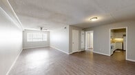 Located at 199 S McLean Blvd in Memphis, TN, this 2-bedroom, 1-bathroom single-story unit offers a practical and well-organized layout. The combined living and dining area is the heart of the home, featuring wood-look flooring, neutral gray walls, a textured ceiling, and a ceiling fan that promotes airflow and comfort. Natural light filters in through slatted blinds, giving the open space a bright and airy feel.

The kitchen is outfitted with white cabinetry, a tile backsplash, light countertops with under-cabinet lighting, and includes a refrigerator and range — providing ample storage and functional workspace. A dedicated utility room adds practical convenience.

Both bedrooms continue the wood-look flooring and neutral color palette, each featuring a ceiling fan and windows with natural light. The primary bedroom offers a comfortable footprint, while the second bedroom is similarly appointed. Notably, the unit includes four closets distributed throughout, providing generous storage for residents.

The single full bathroom features a tub/shower combo with clean white surround and chrome fixtures. A connecting hallway ties the layout together efficiently. Overall, this unit presents a clean, move-in-ready interior with consistent finishes throughout.