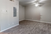 This 360 square foot studio apartment offers a thoughtfully designed living space on a single floor. The open-concept layout maximizes the available area, creating a sense of spaciousness despite its compact size. The living room serves as the central hub, featuring light gray walls and attractive wood-look laminate flooring that extends throughout the unit.

The kitchen, while compact, is efficiently designed with modern appliances, including a full-sized refrigerator. It offers ample cabinet space and a sink with a granite-look countertop, providing essential functionality for daily meal preparation.

The bathroom is fully equipped with a toilet, bathtub-shower combination, and a vanity, all finished in crisp white for a clean, contemporary look. The space also includes a closet for storage, helping to keep the living area clutter-free.

Notable features include a ceiling fan in the main living area for improved air circulation, and vertical blinds on the windows for light control and privacy. The neutral color palette and modern finishes create a versatile canvas for personal decoration.

This studio apartment is well-suited for individuals seeking an efficient, low-maintenance living space in an urban setting. Its layout and amenities make it an ideal option for first-time homeowners, students, or professionals looking for a cozy, functional home.