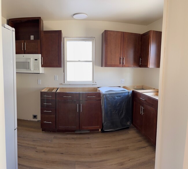 Newly renovated kitchen with brand new countertops, stove & dishwasher on the way. New flooring - 144 Coolidge St