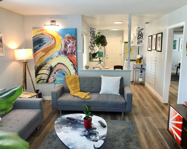 a cozy living room, filled with art from local artists - 2865 58th St