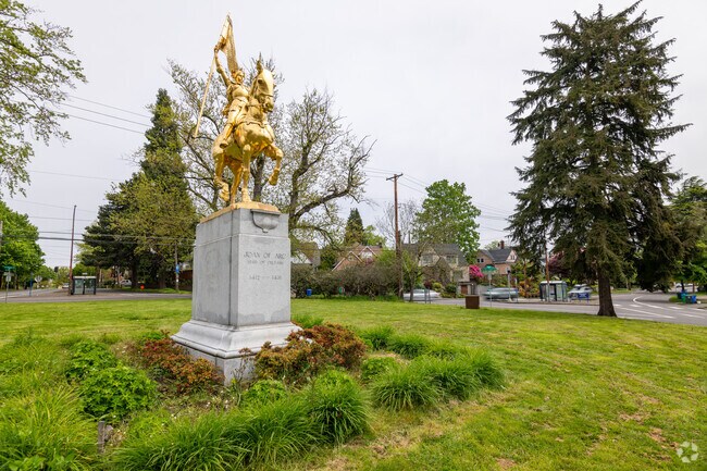 Wide angle of statue with golden tint at Coe Circle in Laurelhurst, Oregon.