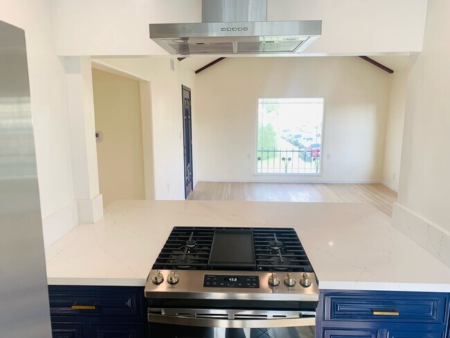 Living room and open kitchen - 3521 S Victoria Ave