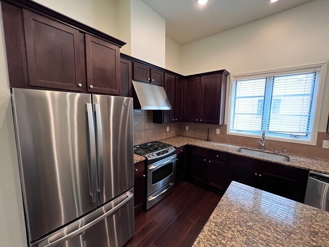 Gas range and vent hood - 3210 Carlisle Street