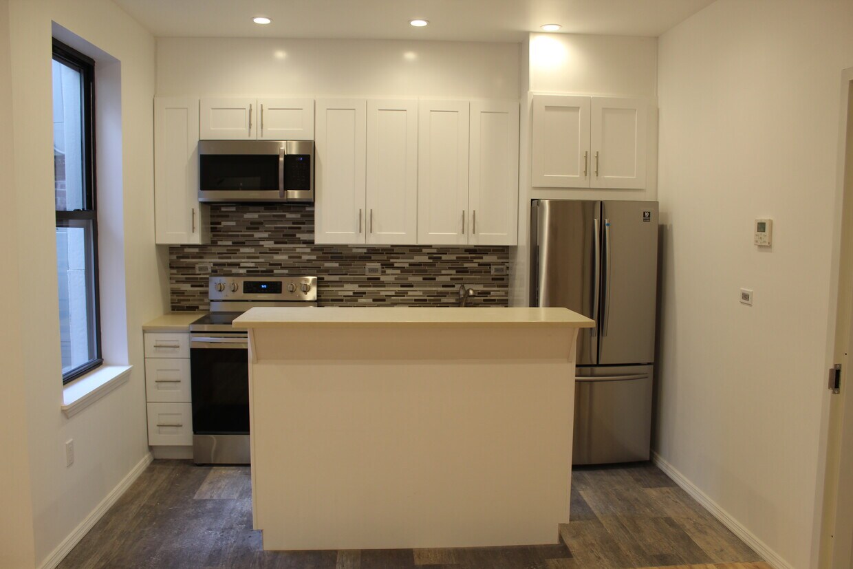 Beautiful Kitchen with an Island - 11613 Liberty Ave
