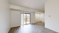 Located at 34830 Pisces Dr. in Sterling Heights, Michigan, this well-appointed one-bedroom, one-bathroom unit offers a clean, modern aesthetic throughout its thoughtfully laid-out single floor. The open living area is bathed in natural light, courtesy of a sliding glass door that leads directly to a private outdoor deck, creating a seamless indoor-outdoor connection. Durable hardwood-style flooring runs throughout the main living spaces, lending a cohesive and contemporary feel.

The kitchen is outfitted with rich dark-stained cabinetry, light marble-style countertops, a stainless steel electric range, and a built-in dishwasher — combining both style and practicality. Recessed lighting in the adjoining area adds a polished touch to the overall layout.

The bedroom is a generously sized retreat finished with plush carpet for added comfort. It features a sliding-door closet with built-in shelving and enjoys natural light from a dedicated window. Direct access to the full bathroom is conveniently situated nearby. The bathroom includes a dark wood vanity with marble-style countertop, wood-look tile flooring, and a tub/shower combination adorned with elegant marble-patterned surround walls. A hallway and dedicated closet round out the functional layout of this well-designed home.