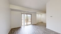 Located at 34830 Pisces Dr. in Sterling Heights, Michigan, this well-appointed one-bedroom, one-bathroom unit offers a clean, modern aesthetic throughout its thoughtfully laid-out single floor. The open living area is bathed in natural light, courtesy of a sliding glass door that leads directly to a private outdoor deck, creating a seamless indoor-outdoor connection. Durable hardwood-style flooring runs throughout the main living spaces, lending a cohesive and contemporary feel.

The kitchen is outfitted with rich dark-stained cabinetry, light marble-style countertops, a stainless steel electric range, and a built-in dishwasher — combining both style and practicality. Recessed lighting in the adjoining area adds a polished touch to the overall layout.

The bedroom is a generously sized retreat finished with plush carpet for added comfort. It features a sliding-door closet with built-in shelving and enjoys natural light from a dedicated window. Direct access to the full bathroom is conveniently situated nearby. The bathroom includes a dark wood vanity with marble-style countertop, wood-look tile flooring, and a tub/shower combination adorned with elegant marble-patterned surround walls. A hallway and dedicated closet round out the functional layout of this well-designed home.