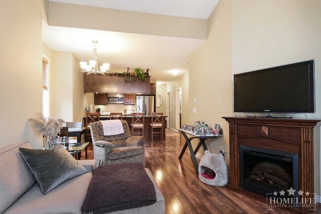 Photo du bâtiment - Exceptional Condo Living in the Heart of Maple Ridge — 1 Bed Plus Den / 1 Bath Corner Unit at Wel...