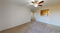 This 600 square foot apartment in Ozark, Missouri, offers a compact yet well-designed living space. The single-story layout comprises one bedroom, one bathroom, a combined kitchen and living area, and a utility room. The primary bedroom, measuring 140 square feet, provides ample space and features a ceiling fan and sliding glass doors leading to an outdoor area, allowing natural light to flood in.

The kitchen is equipped with modern appliances, including a microwave and electric stove. Golden oak cabinetry contrasts nicely with the light-colored countertops and white appliances. The galley-style layout maximizes efficiency in the compact space.

Throughout the apartment, neutral-toned walls and carpeting create a bright, airy atmosphere. The living area seamlessly connects to the kitchen, promoting an open-concept feel. Ceiling fans in main areas help with air circulation and add a decorative touch.

The bathroom features a single vanity with wooden cabinets matching the kitchen style. Light-colored flooring in the kitchen and bathroom areas provides a clean, modern look. The utility room offers additional storage and laundry capabilities.

Overall, this apartment efficiently utilizes its 600 square feet to create a comfortable living space suitable for individuals or couples looking for a low-maintenance home in Ozark.