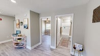 Located at 2300 Davenport Rd in Knoxville, TN, this single-floor unit offers four bedrooms, one bathroom, a living room, and a kitchen within a thoughtfully organized layout. Light wood-look flooring runs throughout, complemented by neutral gray-toned walls and crisp white trim that give the space a clean, contemporary feel.

The living room features recessed lighting, a wall-unit HVAC system, and a window that allows natural light to fill the room. The kitchen is well-appointed with white shaker-style cabinetry, granite-look countertops, stainless steel appliances including a refrigerator and microwave, an electric range, and an undermount sink — making efficient use of the available space.

Each bedroom is modestly sized, equipped with a ceiling fan, individual wall-unit climate control, and windows that bring in natural light and views of the surrounding greenery. The bedrooms also include closets with wire shelving for organized storage.

The bathroom is efficiently designed with a granite-topped vanity, a shower-tub combination, and light flooring that maintains the cohesive aesthetic found throughout the unit. The textured ceilings in select areas add subtle dimension to the overall design. This unit offers a practical and modern living environment suitable for shared or multi-occupant use.