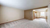 Located at 3950 Cabot Dr. in Springfield, Ohio, this two-story home offers three bedrooms and three bathrooms across two thoughtfully arranged floors. The main level features a welcoming entrance with wood-look flooring that flows into a combined dining room and kitchen. The kitchen is equipped with warm-toned wood cabinetry, granite-style countertops, a double-basin sink, a gas range, dishwasher, and a full-size refrigerator. The adjacent living room is carpeted and features neutral two-tone walls, providing a comfortable and versatile gathering space. A staircase with wood railings connects the main level to the upper floor, where the three carpeted bedrooms are located, each offering natural light through windows and ample closet space. The primary bedroom is a generous size with room for a full furniture arrangement. Three bathrooms throughout the home feature wood-tone vanities with granite-style countertops and wood-look flooring, with at least one full bath including a tub/shower combination. Additional spaces include a laundry room, utility room, pantry, hallway, and an outdoor patio, rounding out this functional and well-organized home.