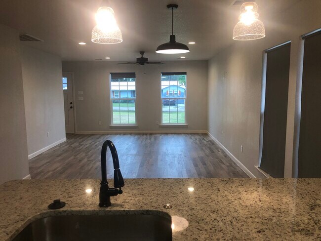 Kitchen into dining and living - 404 Hickorywood St