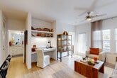 Located at 13030 Perry Rd in Houston, TX, this single-floor residence offers a well-planned layout that maximizes every square foot. Light wood flooring runs throughout, complementing the bright white walls and creating a clean, modern aesthetic.

The open-concept kitchen is outfitted with white shaker cabinetry, granite countertops, stainless steel appliances, and a tiled backsplash. A peninsula with bar seating serves as both a dining and social hub, with pendant lighting overhead. Adjacent dining space provides additional flexibility.

The living room is bathed in natural light from large windows and a glass patio door, fitted with a ceiling fan and direct access to the private patio. A built-in desk nook with floating shelves offers a dedicated workspace seamlessly integrated into the main living area.

The bedroom is a serene retreat featuring a ceiling fan, generous windows with natural light, and direct access to a well-appointed bathroom with white cabinetry and warm vanity lighting.

A dedicated laundry area with a full-size washer and dryer sits conveniently off the kitchen, alongside a closet for additional storage. The private patio extends the living space outdoors, completing this efficiently designed and stylish Houston residence.