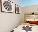 This 420-square-foot, one-bedroom, one-bathroom apartment on the ground floor at 4800 Tanner Dr, Unit 102, Gillette, WY, delivers a thoughtfully designed and efficient living space. The open-concept main area seamlessly connects the living room, dining area, and kitchen, maximizing the use of available square footage. Light wood-style flooring runs throughout, contributing to a bright and cohesive aesthetic. The kitchen features dark cabinetry, a stainless steel refrigerator, microwave, and range, complemented by a bold yellow accent ceiling that adds a distinctive architectural touch. Recessed lighting illuminates the space, while a window in the living area provides natural light. The bedroom, measuring 80 square feet, offers a cozy retreat with neutral walls, wall-mounted lighting, and access via a hallway. The bathroom includes a modern vanity with a white countertop, gray cabinetry with brushed nickel hardware, a large mirror, and wood-style flooring. A hallway connects the main living areas to the private spaces, adding practical flow to the layout. This unit is well-suited for individuals or couples seeking a functional and stylish home in Gillette, Wyoming.