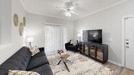 Located at 520 Windview Way in Knoxville, TN, this thoughtfully designed one-bedroom, one-bathroom residence offers a comfortable and functional single-floor layout. The open-concept living, dining, and kitchen area forms the heart of the home, bathed in natural light from large windows fitted with blinds. The living room features crown molding, a ceiling fan, and sliding glass doors that lead to a private patio. The adjacent dining area is highlighted by a pendant light fixture and a bright window with outdoor views, creating an inviting space for meals. The kitchen is well-appointed with white cabinetry, ample counter space, and full appliances including a range and refrigerator, with easy access to the dedicated laundry area. The spacious primary bedroom is carpeted for comfort, includes a ceiling fan, multiple windows, and benefits from two closets — one of which is a walk-in. The full bathroom features a tub/shower combination, a vanity with a large mirror, and hardwood-style flooring. Additional storage is provided throughout, including a second closet and extra cabinetry. The neutral, light-toned palette and wood-style flooring across the main living areas contribute to a clean, modern ambiance throughout.
