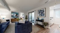 Located at 850 N Center Ave in Ontario, CA, this single-story, one-bedroom, one-bathroom residence offers a smartly designed layout across a compact but efficient floor plan. The living room is a bright, welcoming space featuring wood-look flooring, clean white walls, and a sliding glass door that opens to a private outdoor patio, filling the room with natural light. The kitchen is galley-style, outfitted with white cabinetry, stone-look countertops, stainless steel appliances including a refrigerator and electric range, and a window that brings in additional natural light — all set on matching wood-look flooring. The bedroom is a well-proportioned retreat with plush carpeting, a window with outdoor greenery views, and a mirrored sliding closet for convenient storage. The full bathroom is notably spacious, offering a dual-sink vanity with stone-look countertops, white cabinetry, large mirrors with overhead lighting, wood-look flooring, and an additional mirrored closet. Throughout the residence, the design maintains a cohesive, contemporary aesthetic with neutral tones, clean finishes, and functional layouts that maximize the available space efficiently.