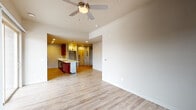 Located at 412 S Nevada Ave in Colorado Springs, CO, this single-floor residence offers a thoughtfully designed open-concept layout with a clean, modern aesthetic. Light hardwood-style flooring flows seamlessly throughout the main living areas, complemented by neutral wall tones that create a bright and welcoming atmosphere.

The living area is spacious and airy, featuring a ceiling fan and a sliding glass door that invites natural light while providing access to an outdoor area. The open sightlines connect the living space directly to the kitchen, enhancing the sense of flow and functionality.

The kitchen is a standout feature, showcasing rich dark-wood cabinetry with brushed nickel hardware, crisp white countertops, and a full suite of stainless steel appliances including a refrigerator, range, and microwave. Stylish pendant lighting and recessed fixtures illuminate the space, while a generous island with an undermount sink adds both prep space and visual interest.

The bedrooms are well-proportioned, each with hardwood-style flooring, ceiling fans, and ample natural light. The bathroom is finished with white subway tile surrounding a full soaking tub and shower combination, fitted with brushed nickel fixtures for a polished look.

Overall, this residence balances functional design with modern finishes, making it a comfortable and attractive space in the heart of Colorado Springs.