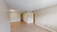 Located at 1000 Beacon Pkwy E in Birmingham, Alabama, this single-floor home offers three bedrooms and two bathrooms within a practical and well-organized layout. Light wood-style flooring runs consistently throughout the home, lending a clean and cohesive aesthetic to every room. Neutral-toned walls and white trim provide a bright, move-in-ready appearance across the entire space.

The spacious primary bedroom benefits from a ceiling fan with integrated lighting and a window that invites natural light, creating a comfortable and airy atmosphere. The additional bedrooms are similarly finished, each featuring light flooring and closet access, with one room offering direct connectivity to other areas of the home via an open doorway.

The kitchen is well-appointed with white cabinetry, granite-style countertops, a stainless steel sink, and black appliances including a refrigerator and dishwasher, all set against light wood flooring. The living area is open and bright, with a window providing outdoor views and access to both the entry door and interior rooms.

Both bathrooms are neatly finished — one features a walk-in shower with a curved curtain rod, while the other includes a vanity with a granite-style countertop, wood cabinetry, and overhead lighting. A hallway connects the rooms efficiently, completing this functional and well-maintained home.
