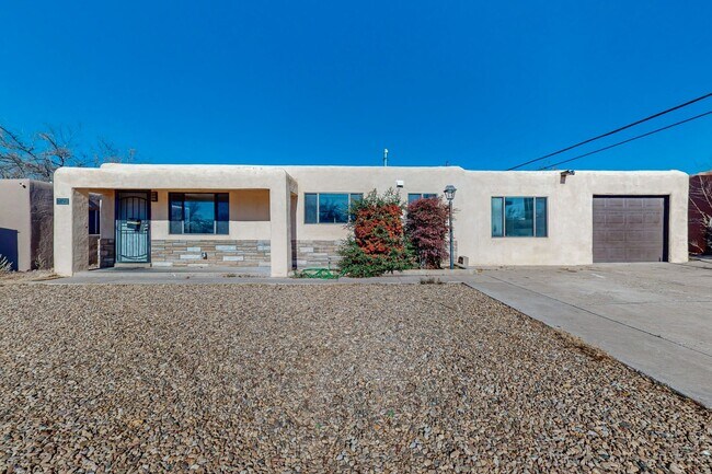 Building Photo - NE PUEBLO STYLE 3 Bedroom 2 Bath 1824/SF