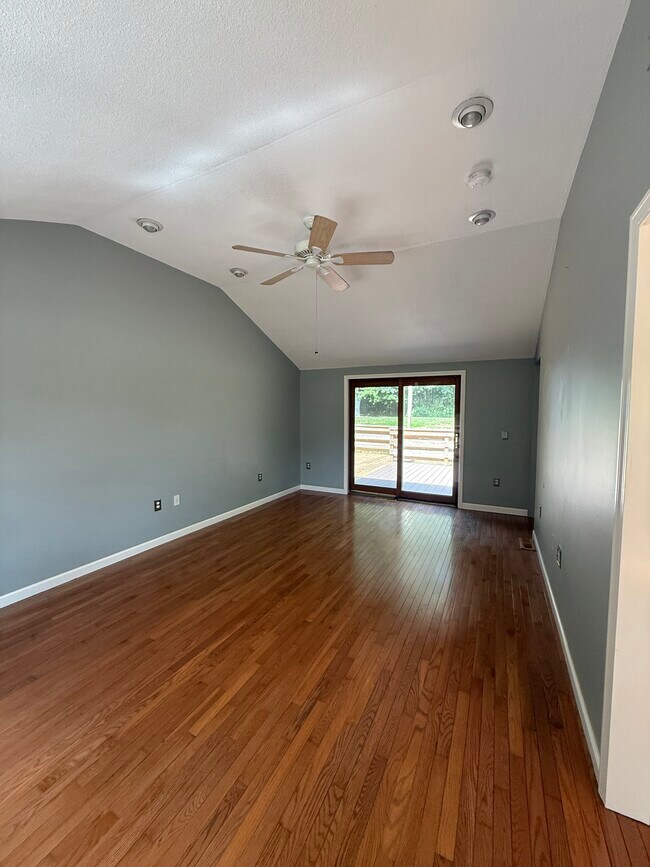 Family room Vaulted ceiling w/fan & sliders to deck & large backyard - 60 Minechoag Hts