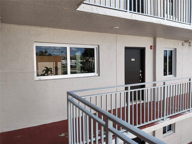 Building Photo - 9911 W Okeechobee Rd