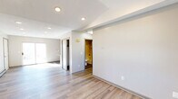 Located at 94 West St in Vernon Rockville, CT, this one-bedroom, one-bathroom unit offers a thoughtfully arranged single-floor layout. Light-toned luxury vinyl plank flooring runs throughout the space, creating a cohesive and clean aesthetic in every room. The living room is bright and open, featuring recessed lighting, a baseboard heating system, and a sliding glass door that opens to an outdoor balcony, allowing natural light to fill the space. The kitchen is a standout feature, showcasing granite countertops, gray shaker-style cabinetry with modern hardware, a mosaic tile backsplash, and stainless steel appliances including a refrigerator and electric range. A dedicated closet off the kitchen provides convenient pantry or storage access. The bedroom is comfortably sized, featuring a window with views of the surrounding greenery, baseboard heating, and a wall-mounted light fixture. A dedicated closet is also accessible from the hallway. The bathroom includes a full-size soaking tub with a combined shower, chrome fixtures, and clean white surround walls. A utility room completes the layout, offering additional functional space. The overall ambiance is clean, updated, and move-in ready.