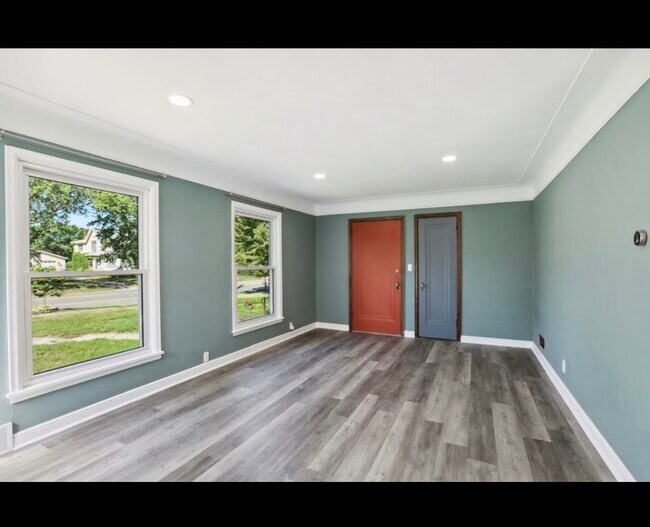 Spacious Living Room with a great entryway closet! - 4340 W Broadway Ave