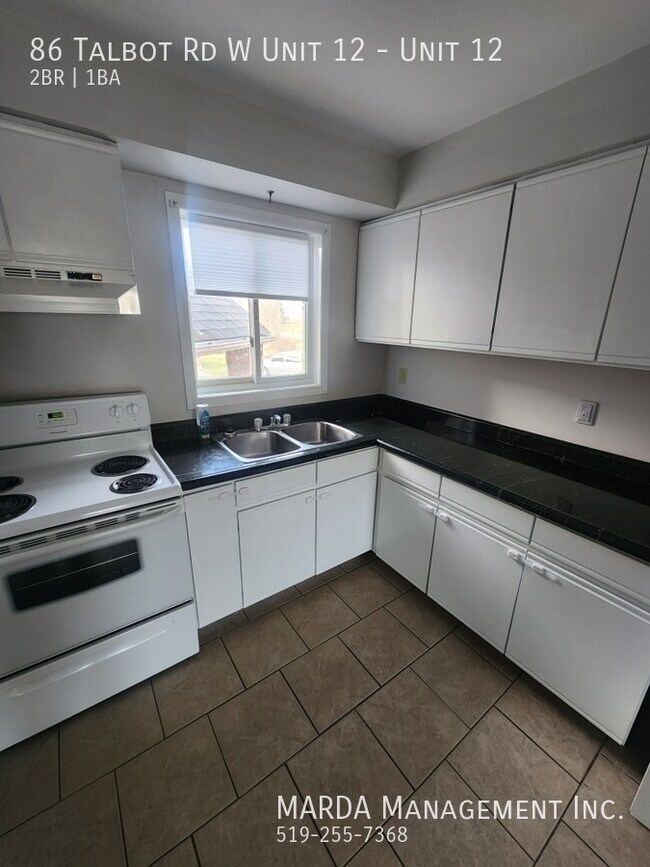 Photo du bâtiment - CHARMING 2 BED/ 1 BATH APT IN WHEATLEY + HYDRO & WATER