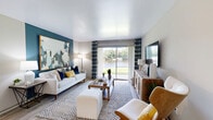 Located at Confederate Point Road in Jacksonville, FL, this well-appointed 2-bedroom, 2-bathroom single-story residence offers a thoughtfully designed open-concept floor plan. Light wood-style flooring flows throughout, creating a cohesive and airy feel across all rooms.

The combined living and dining area serves as the heart of the home. The dining space features a ceiling fan and connects seamlessly to the living room, which is highlighted by a sliding glass door offering direct waterfront views — a standout feature that fills the room with natural light. A teal accent wall anchors the living area with a bold design touch.

The kitchen is outfitted with white shaker cabinets with gold hardware, granite countertops, and stainless steel appliances including a range, microwave, and dishwasher. In-unit laundry with a full-size washer and dryer adds everyday convenience.

The primary bedroom is generously sized, featuring a walk-in closet and windows that invite natural light. The second bedroom also includes dedicated closet space. Both bathrooms are finished with granite countertops and tub-shower combinations with tile surrounds.

With four closets total, a dedicated hallway, and a welcoming entryway, this residence provides practical storage and a functional layout suited for comfortable Jacksonville living.