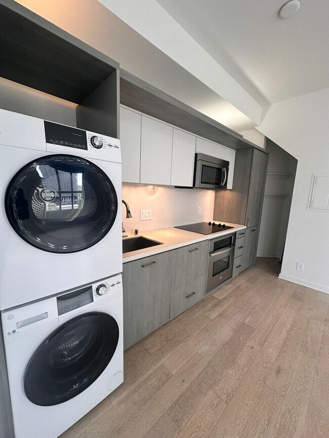 Building Photo - DOWNTOWN GEM | Modern Two-Level Loft with Private Patio & Rooftop Deck