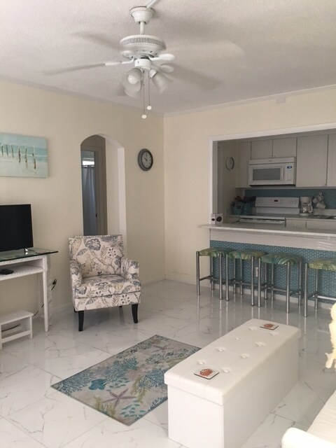 Living room looking into BFast bar/kitchen - 649 Royal Palm Blvd