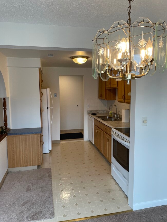 Kitchen view from dining area. - 1 Cambridge Sq
